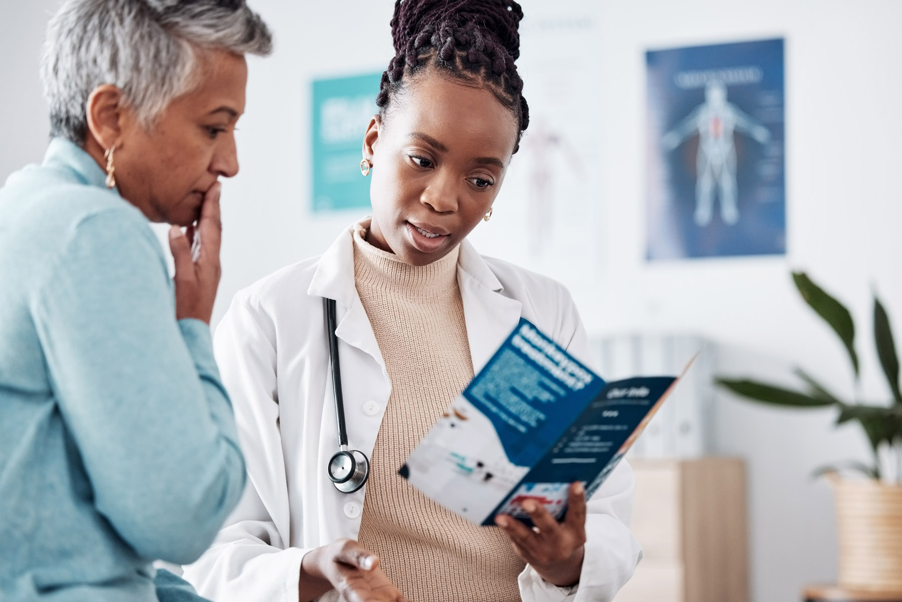doctor-explaining-treatment-brochure-to-patient