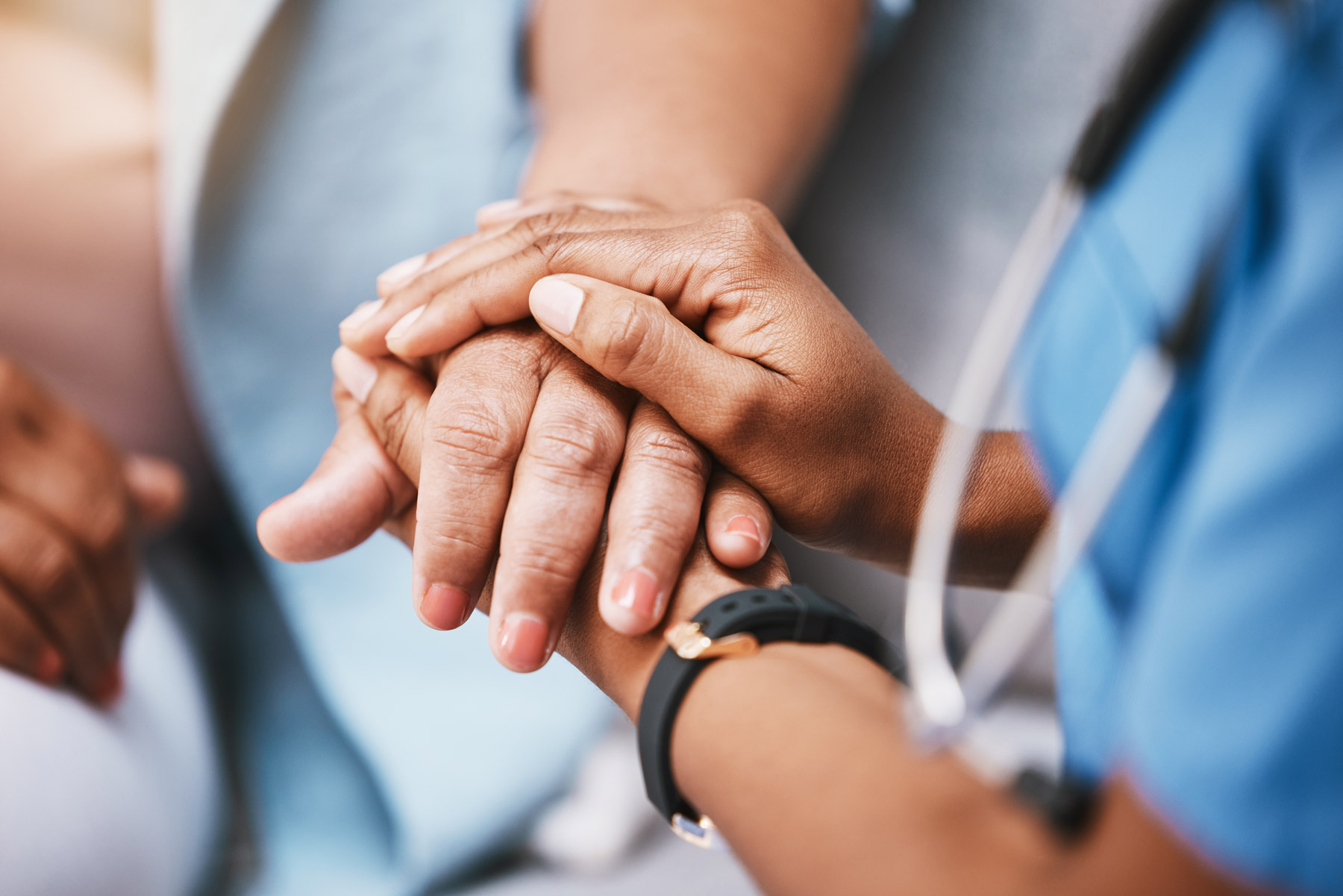 nurse-holding-patients-hand-closeup